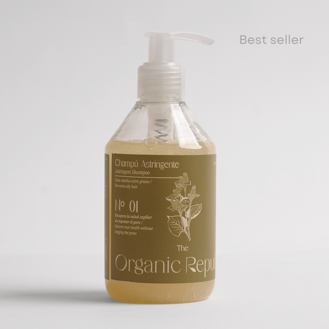 Natural astringent liquid shampoo bottle for oily hair with fresh citrus ingredients on white background