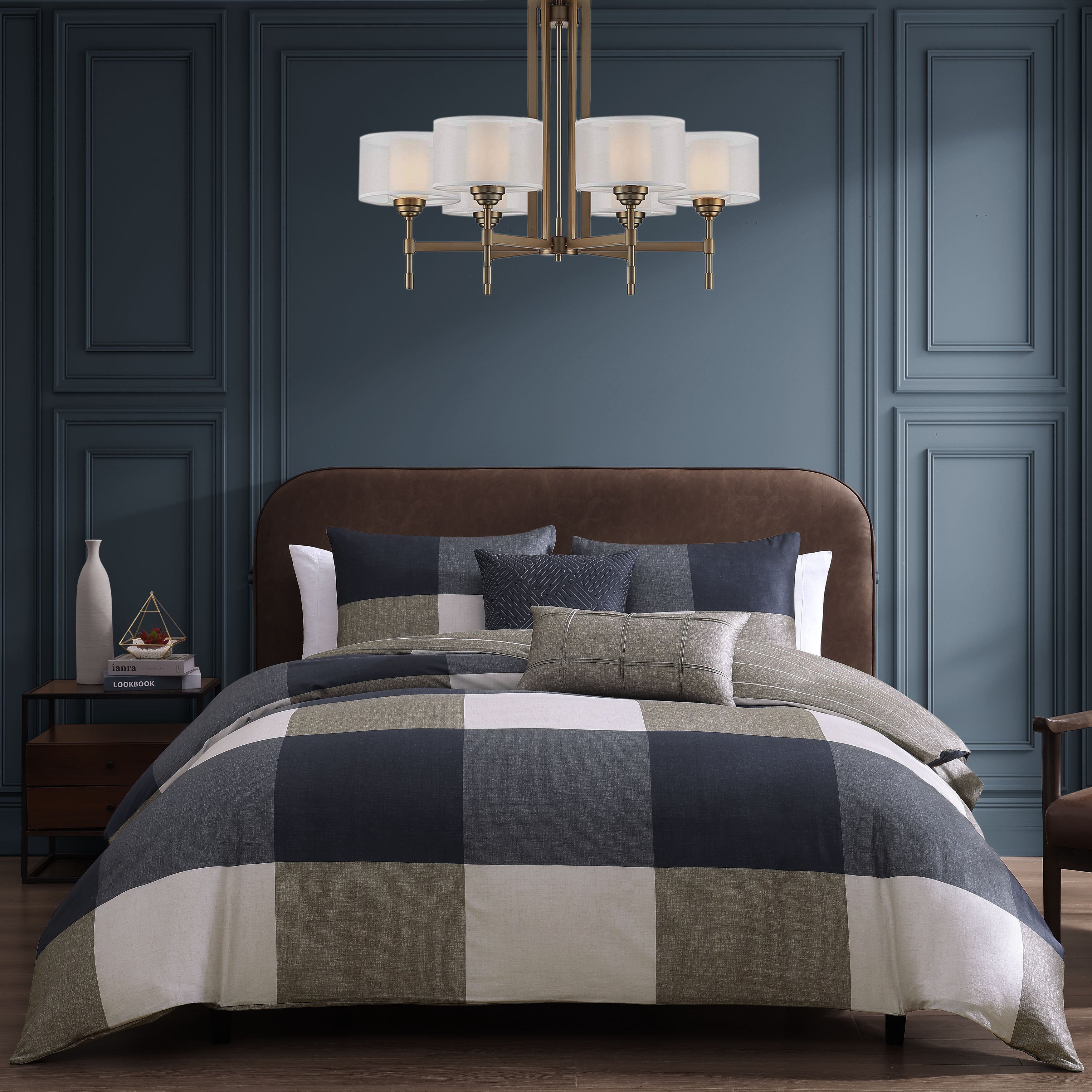 Navy and tan plaid five piece reversible comforter set with shams and decorative pillows.