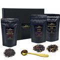 Luxury loose leaf tea gift box in black with three tea pouches and gold measuring spoon