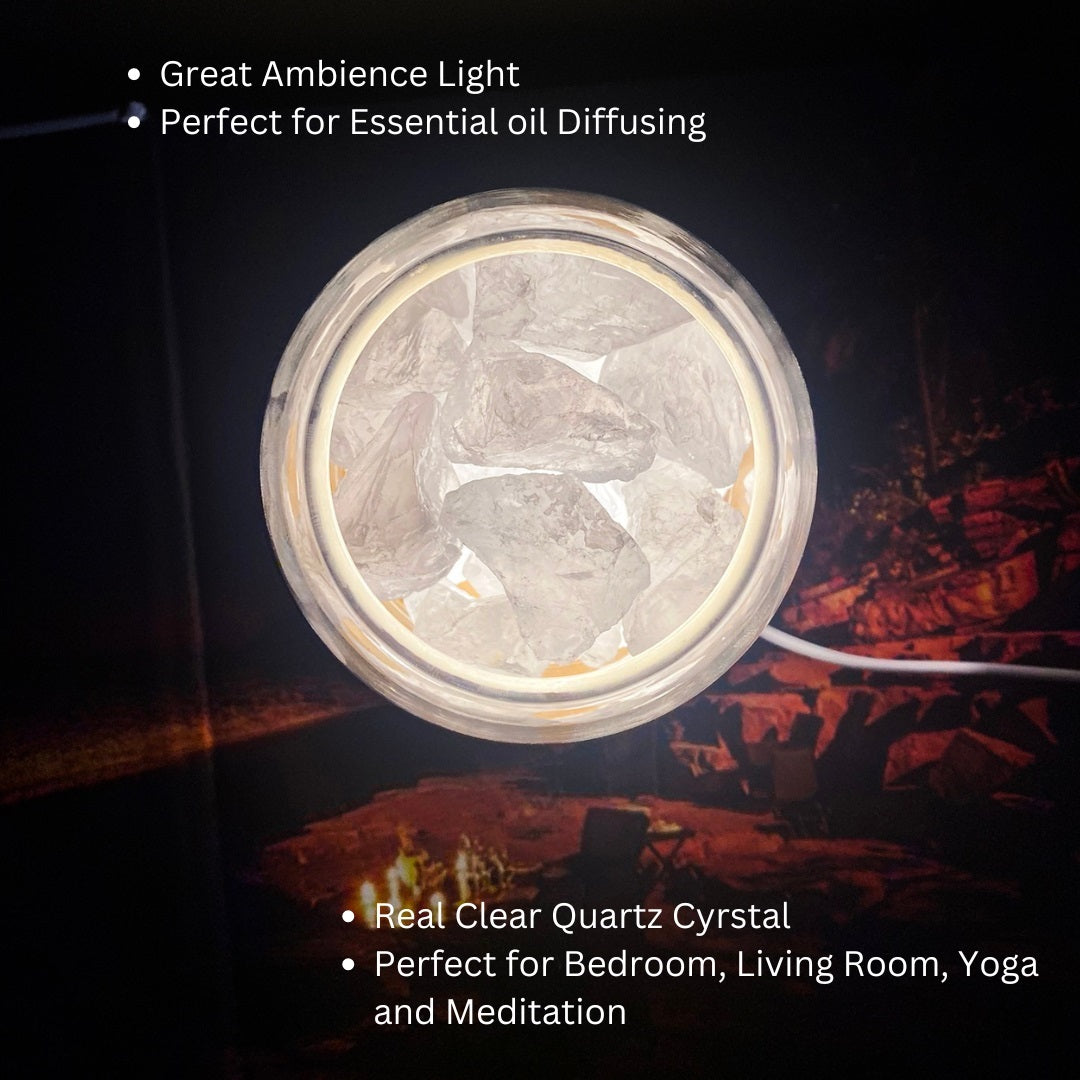 AURORA natural quartz crystal essential oil diffuser with wooden base and glass reservoir illuminated. — view 4