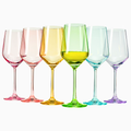 Set of six vibrant colored hand blown crystal wine glasses arranged for an elegant dinner setting
