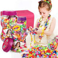 Colorful DIY bead craft kit with 600 vibrant plastic pieces in a clear storage box