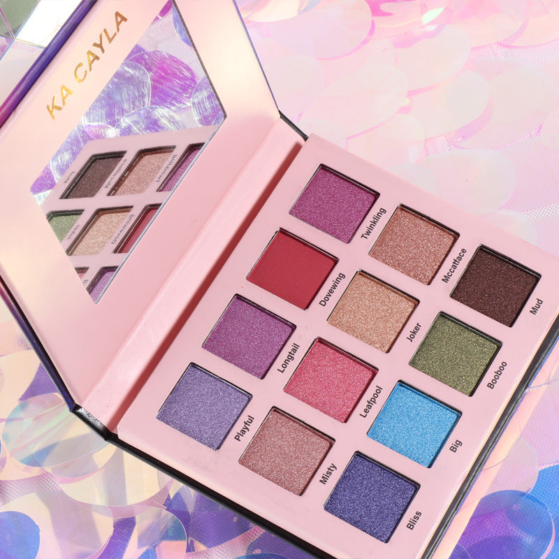 Open 12-color eyeshadow palette in a compact black case showing vibrant and neutral shades — view 2