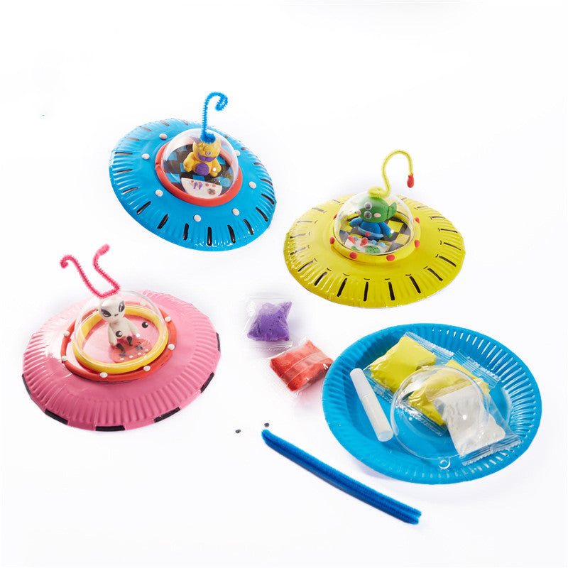 Kids art and craft kit featuring colorful paper plates and alien craft materials for creative play