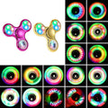 Luminous LED fidget spinner glowing in the dark crafted from lightweight ABS for stress relief