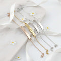 Custom engraved name bracelet in polished stainless steel showcasing personalized text on a delicate chain