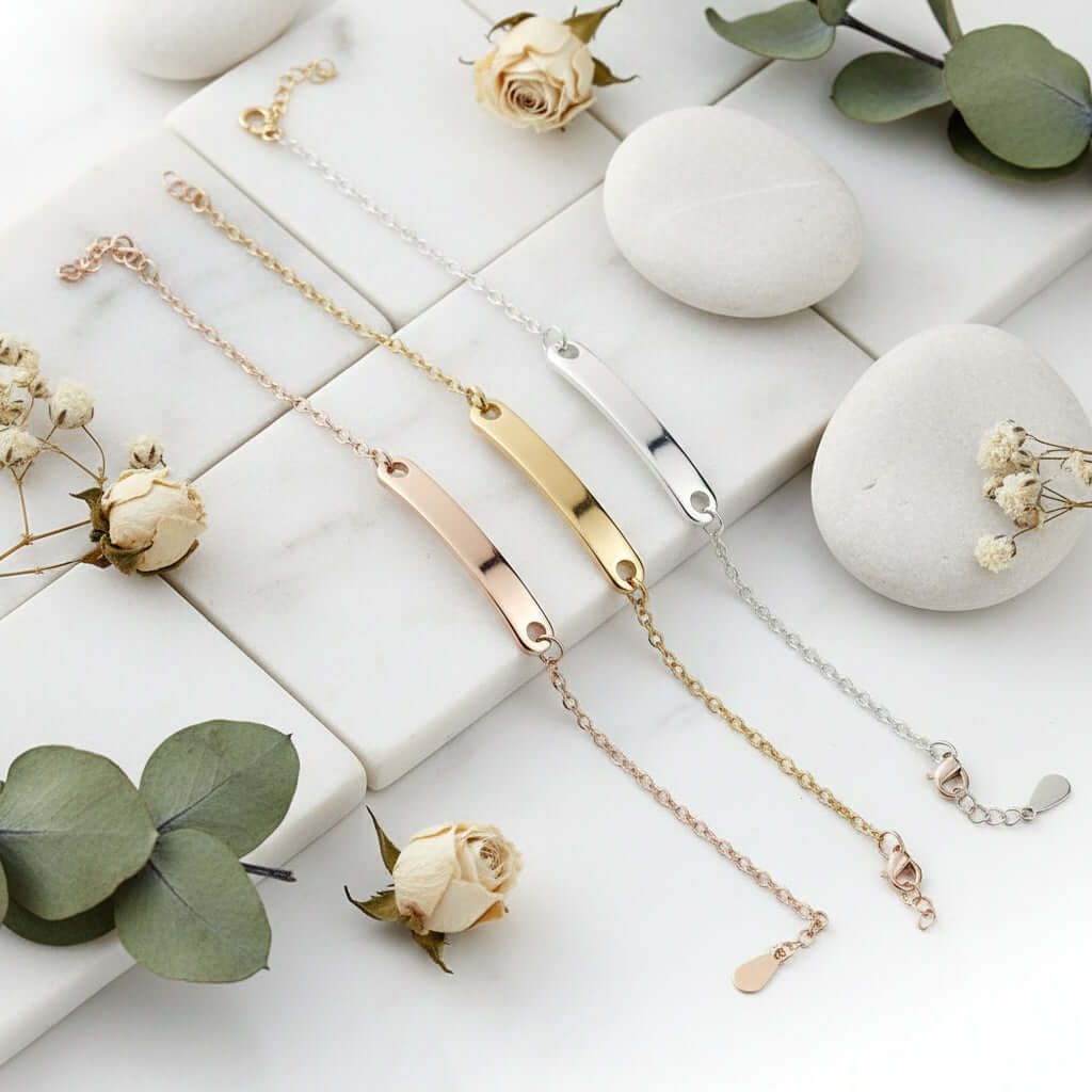 Custom engraved name bracelet in polished stainless steel showcasing personalized text on a delicate chain — view 3