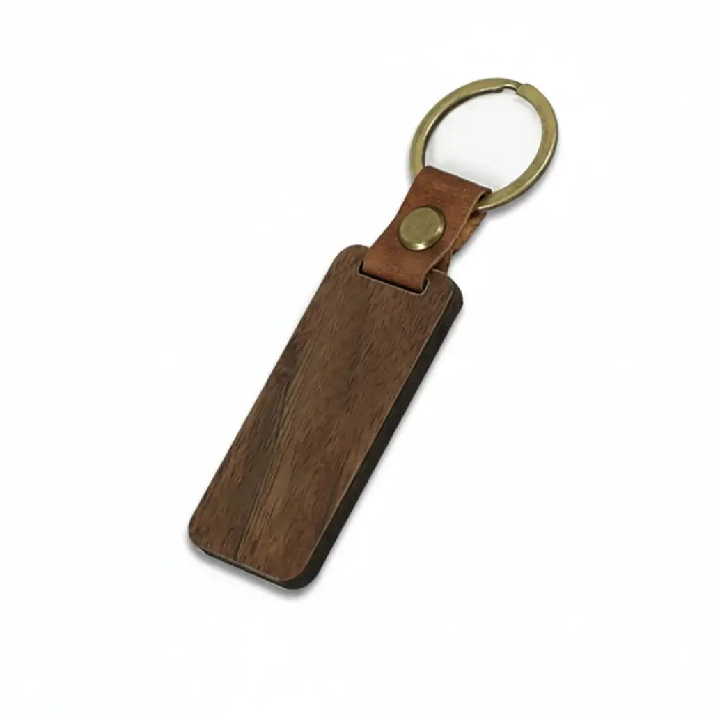 Custom engraved wooden keychain with PU leather strap and copper ring on white background