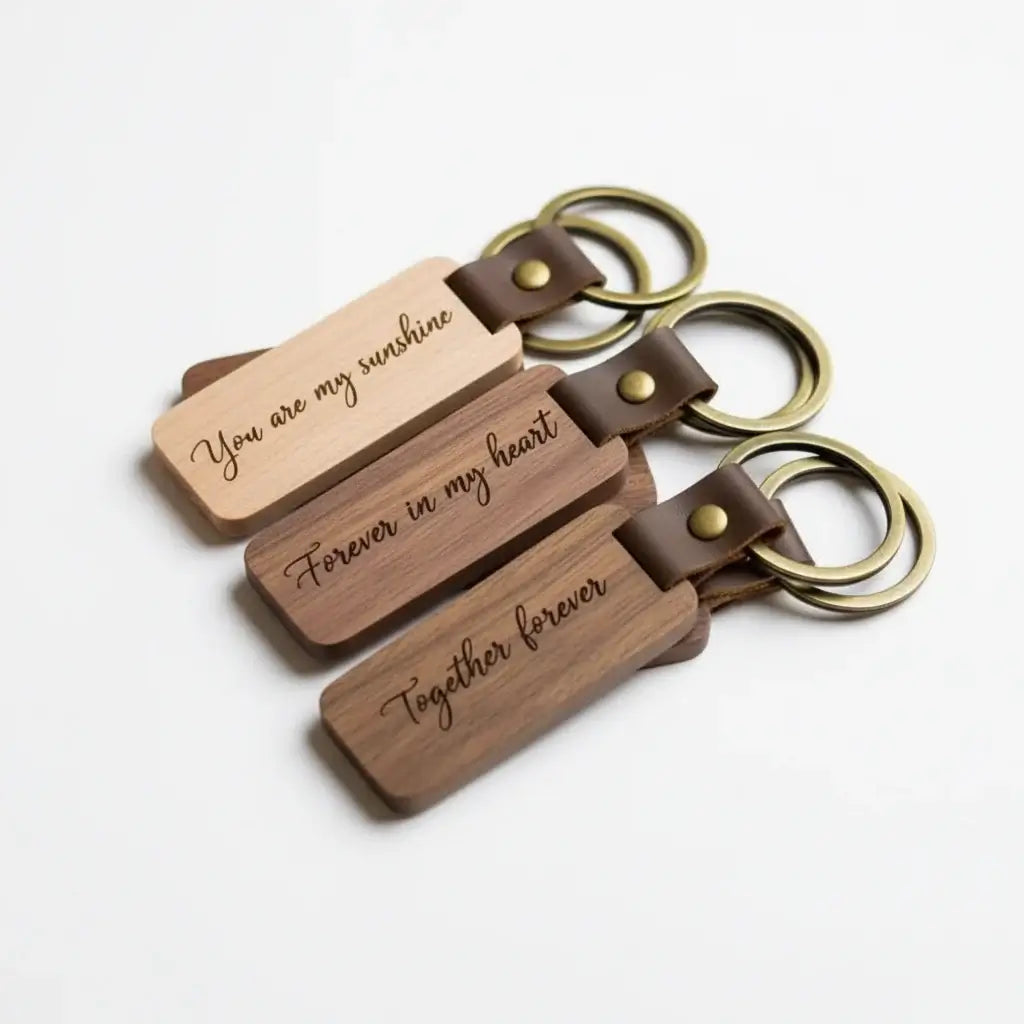 Custom engraved wooden keychain with PU leather strap and copper ring on white background — view 2