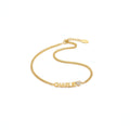 Custom engraved name bracelet in polished stainless steel displayed as an elegant personalized jewelry piece
