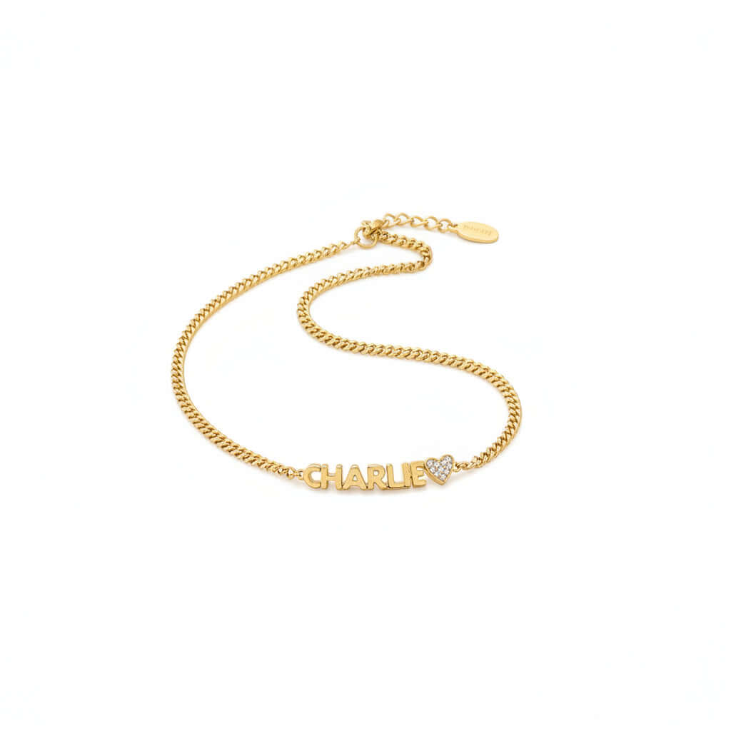 Custom engraved name bracelet in polished stainless steel displayed as an elegant personalized jewelry piece