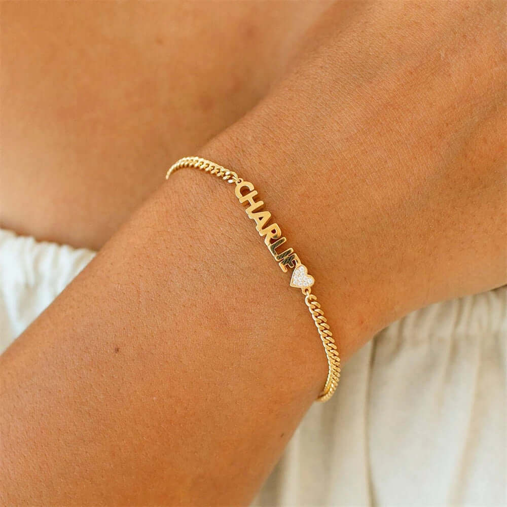 Custom engraved name bracelet in polished stainless steel displayed as an elegant personalized jewelry piece — view 3
