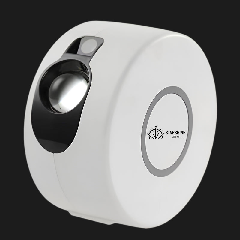 Compact G2 mini LED galaxy projector emitting colorful nebula light and green laser stars indoors.