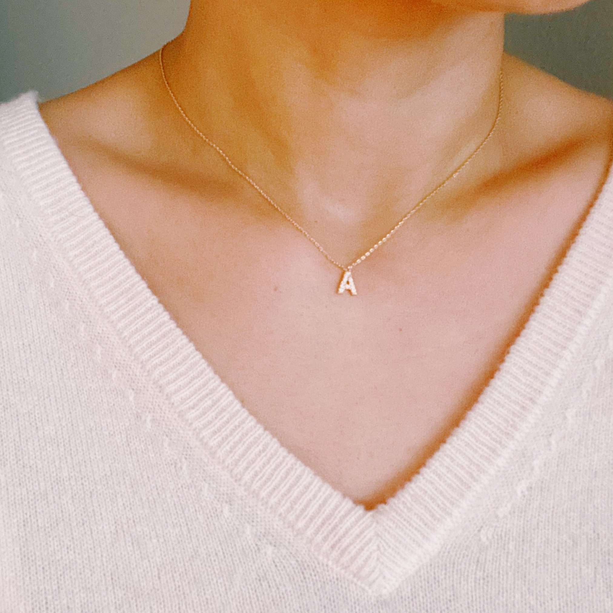 18k gold plated initial necklace with cubic zirconia stones on a delicate chain — view 4