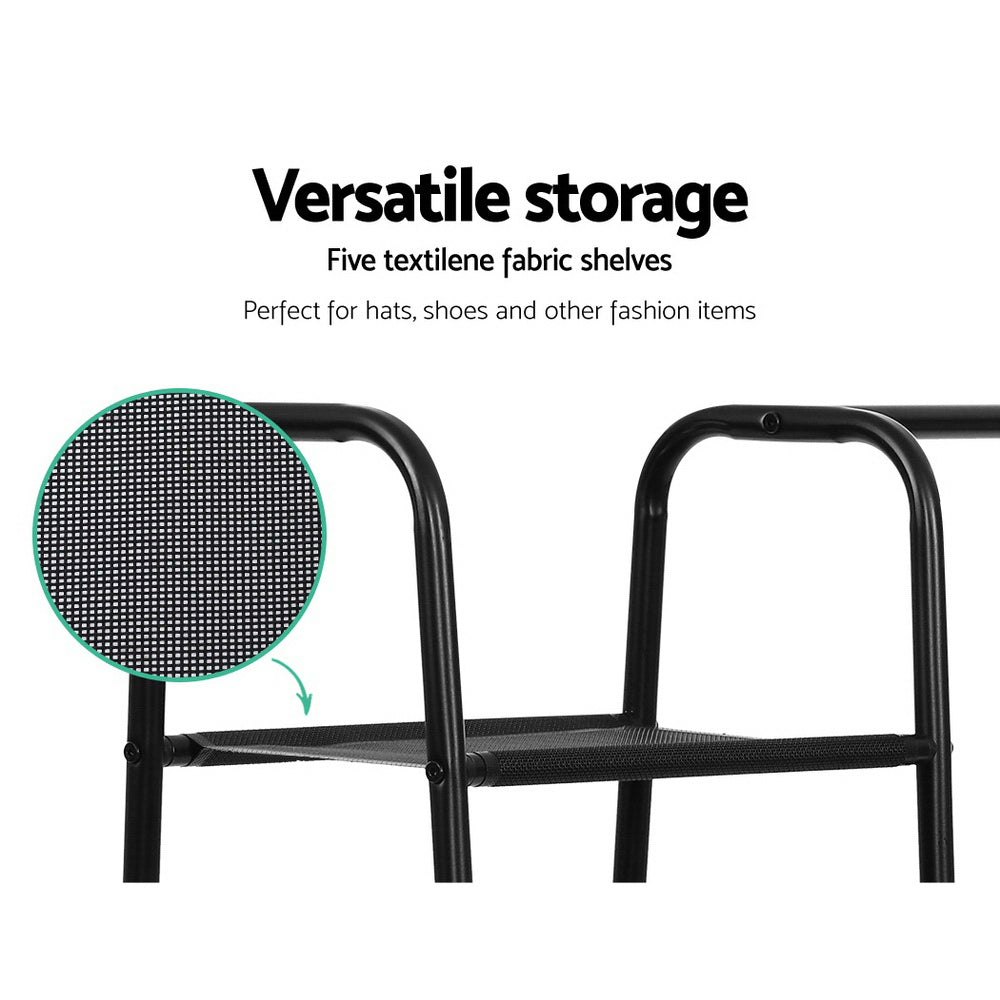 Black metal freestanding clothes rack with a hanging bar and five fabric storage shelves. — view 5