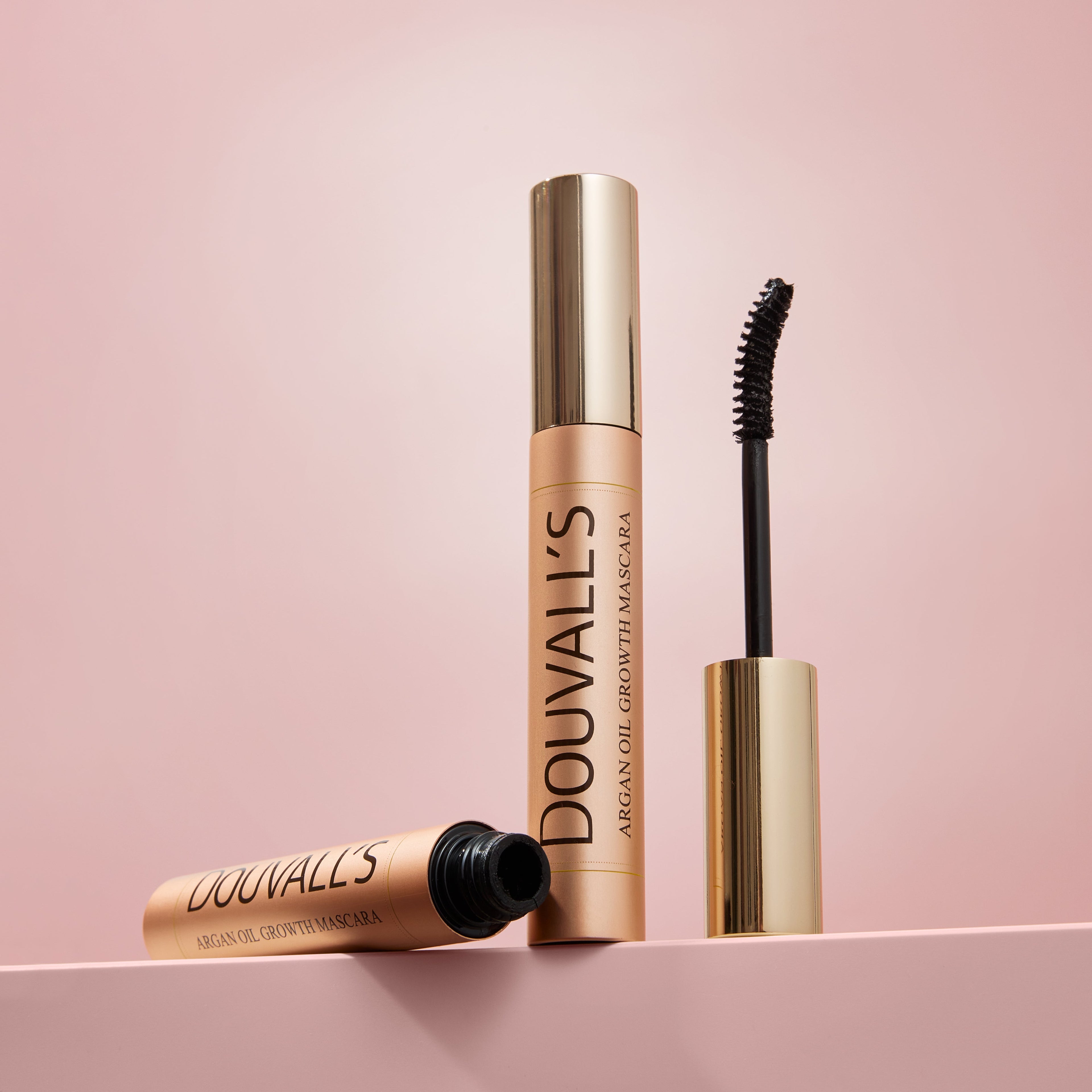 Black Argan Growth Serum Mascara tube with curved applicator brush for volumizing and lifting eyelashes. — view 5