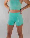 Women's seamless gym shorts featuring a high-waisted, ribbed, breathable fabric design for summer fitness routines