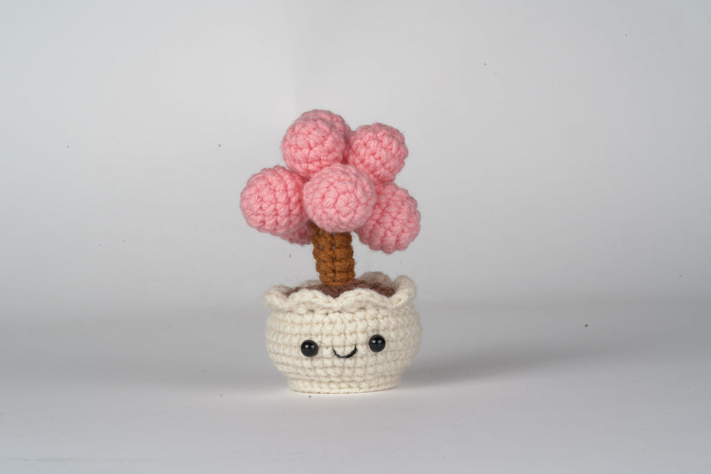 Amigurumi DIY crochet kit with premium yarn, stuffing, hook, and tutorial card in paper bag — view 4