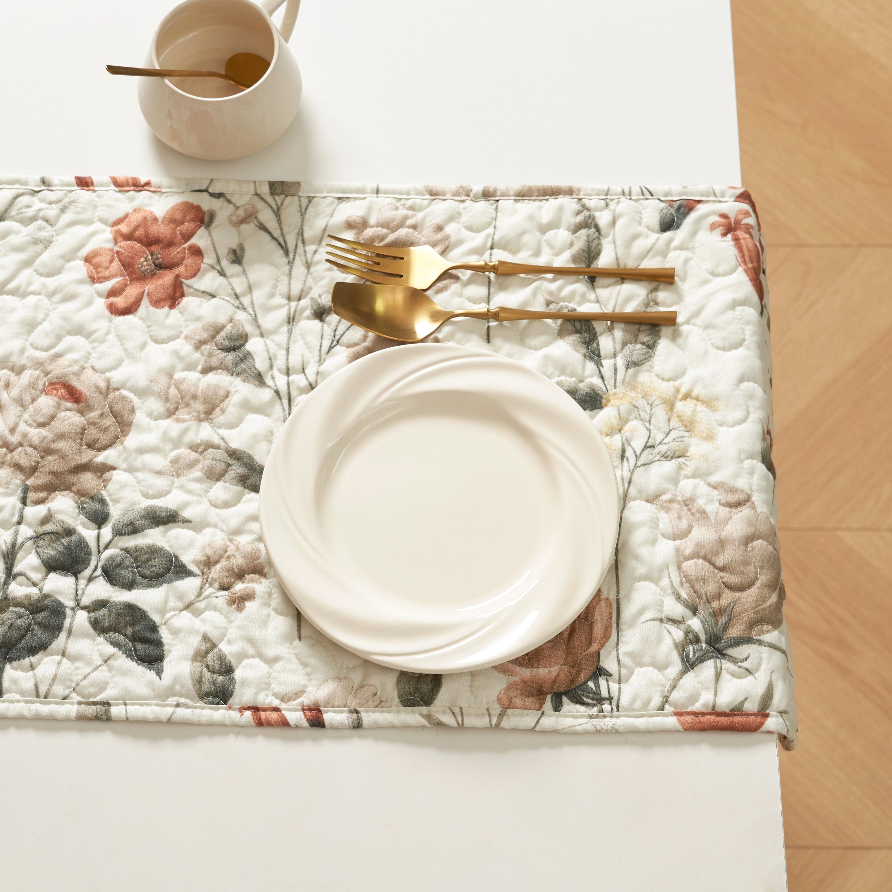 Reversible floral quilted table runner in beige and soft green for dining room tabletop protection — view 3