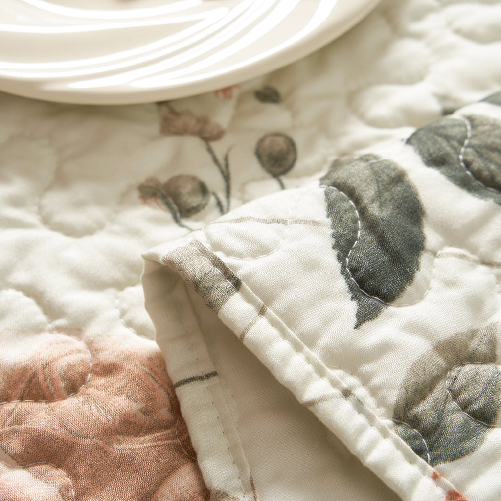 Reversible floral quilted table runner in beige and soft green for dining room tabletop protection — view 5