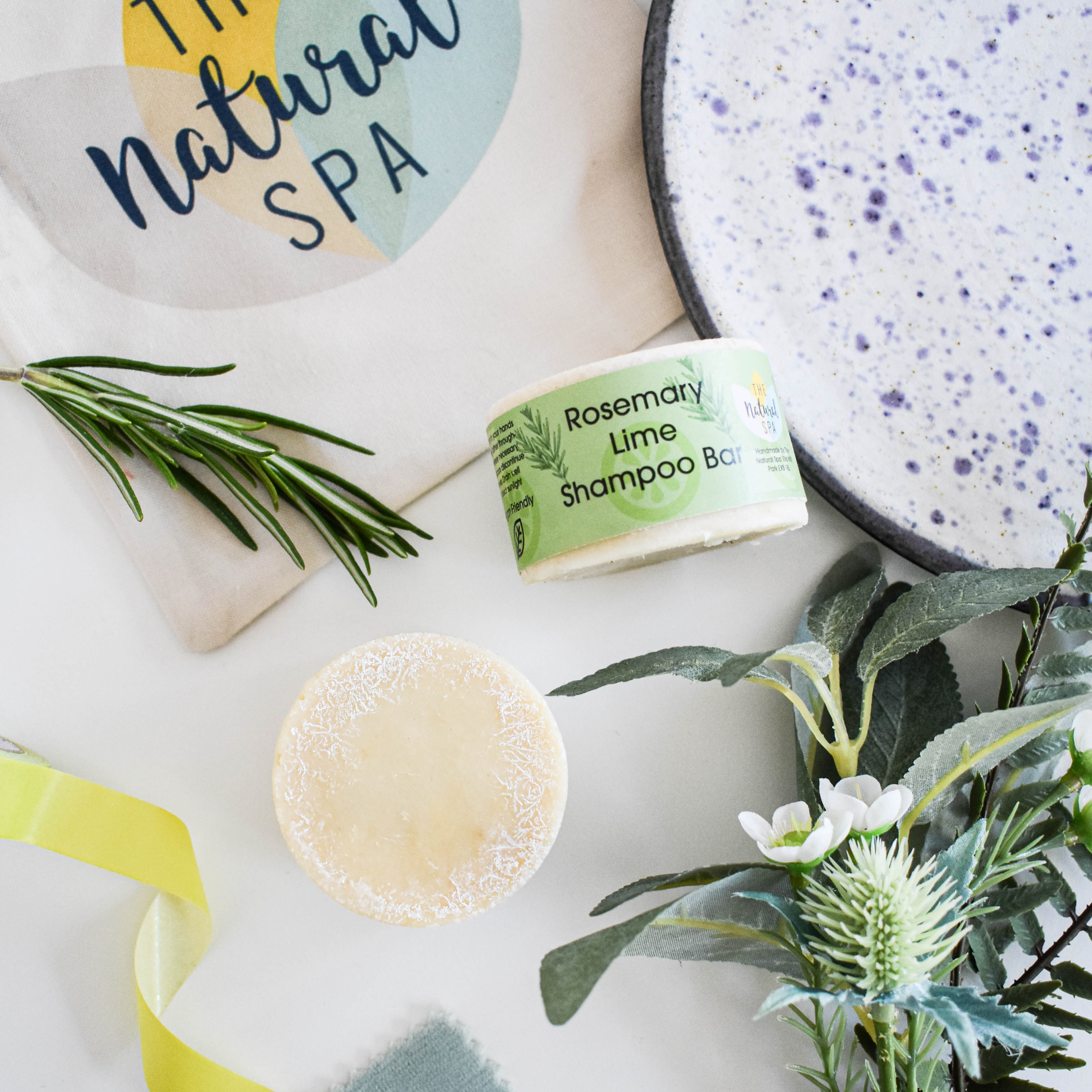 Rosemary and lime solid shampoo bar in plastic-free packaging for natural hair care
