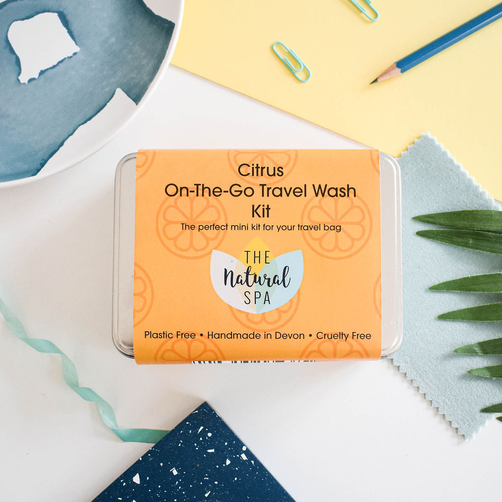 Citrus mini travel wash kit featuring solid vegan soap bars and a reusable aluminum tin