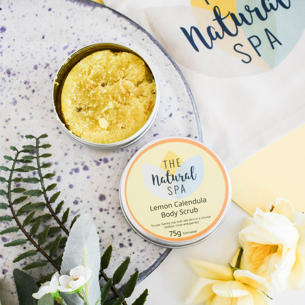 Lemon calendula sugar body scrub in plastic-free packaging showcasing a natural exfoliating granular texture