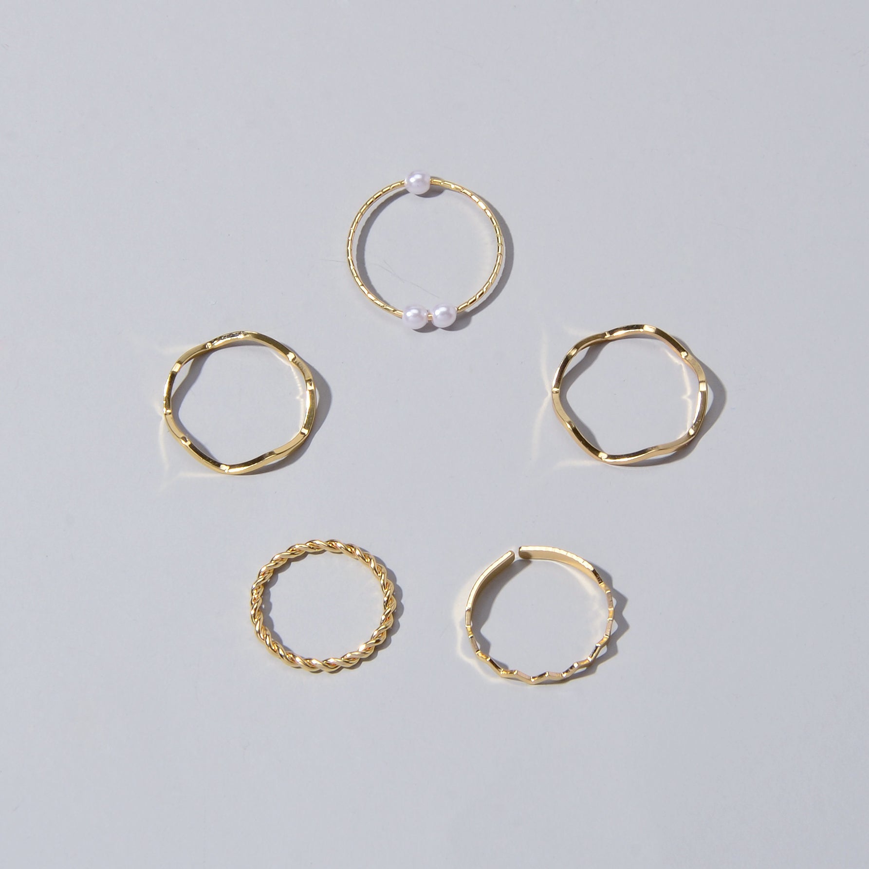 5 piece stackable minimalist finger ring set in metal with elegant pearl accents — view 5