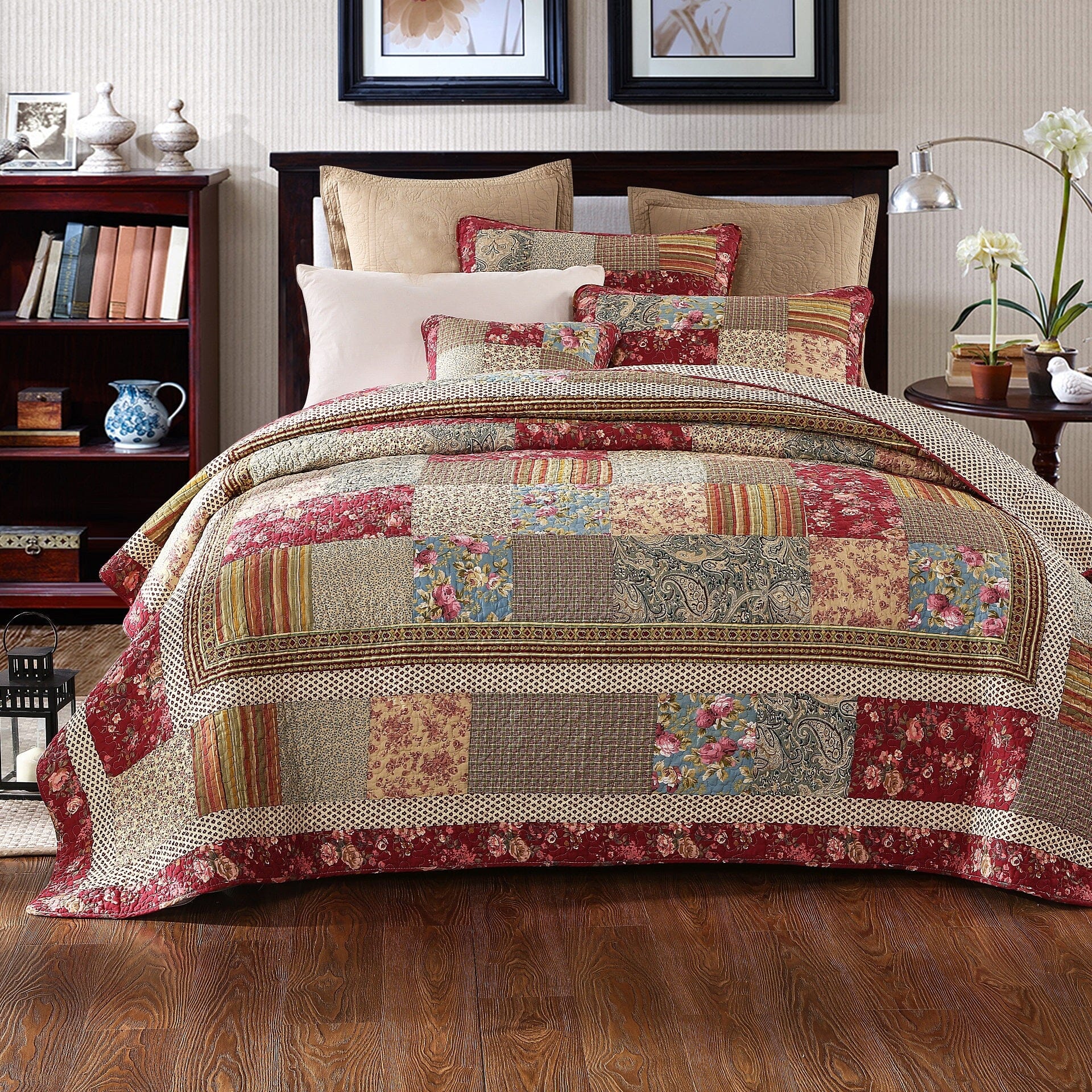 Cotton patchwork quilt set featuring a beige and burgundy floral paisley pattern on a bed