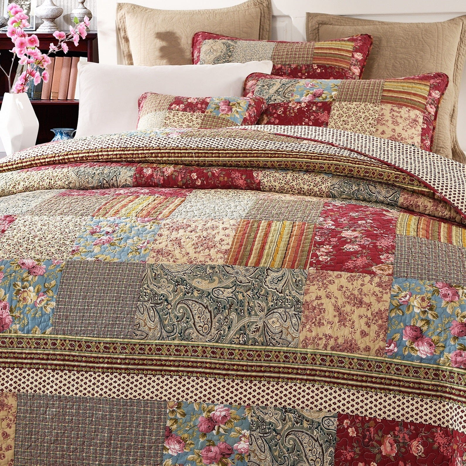 Cotton patchwork quilt set featuring a beige and burgundy floral paisley pattern on a bed — view 3