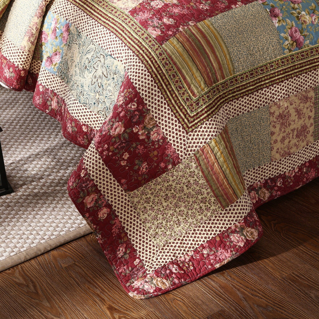 Cotton patchwork quilt set featuring a beige and burgundy floral paisley pattern on a bed — view 5