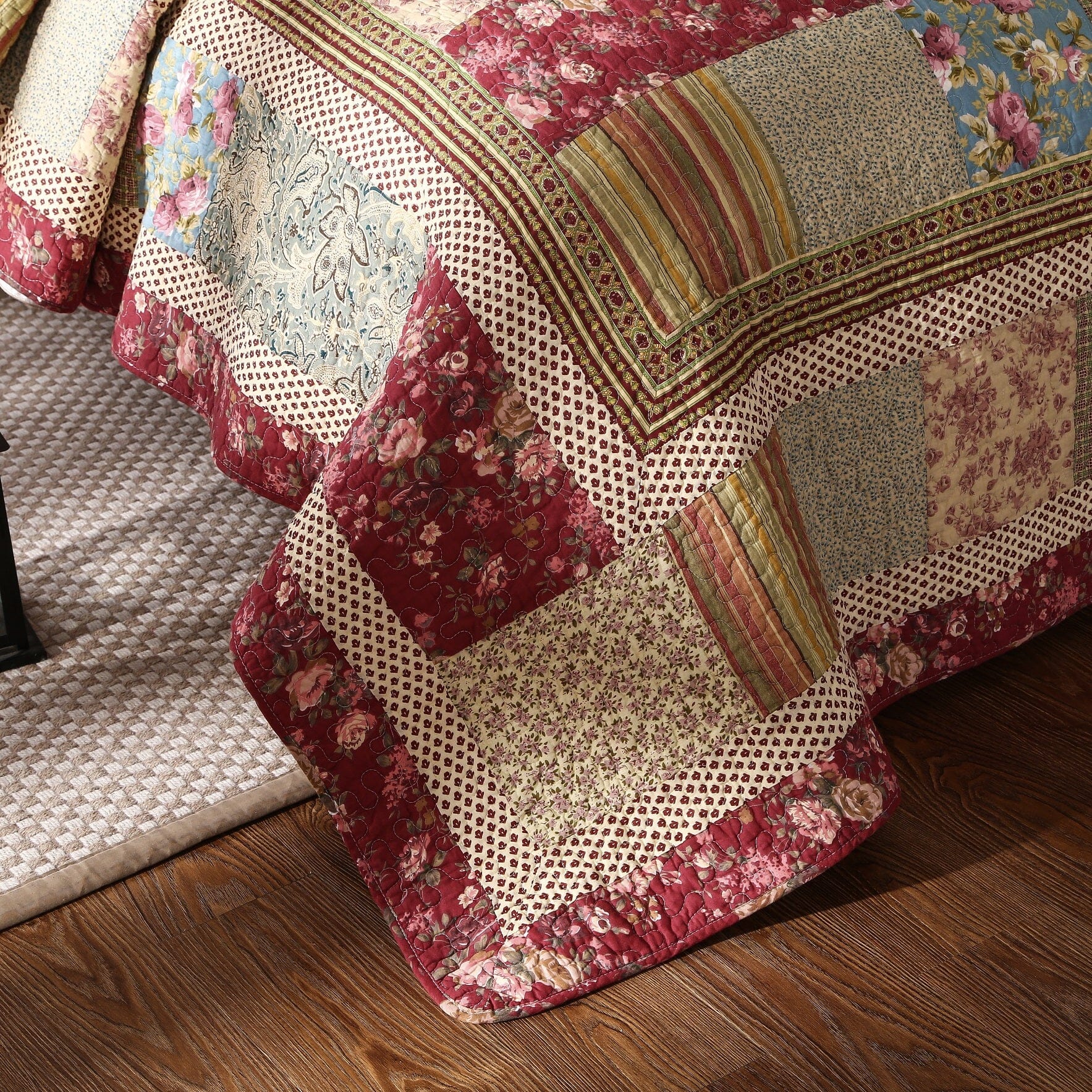 Cotton patchwork quilt set featuring a beige and burgundy floral paisley pattern on a bed — view 5
