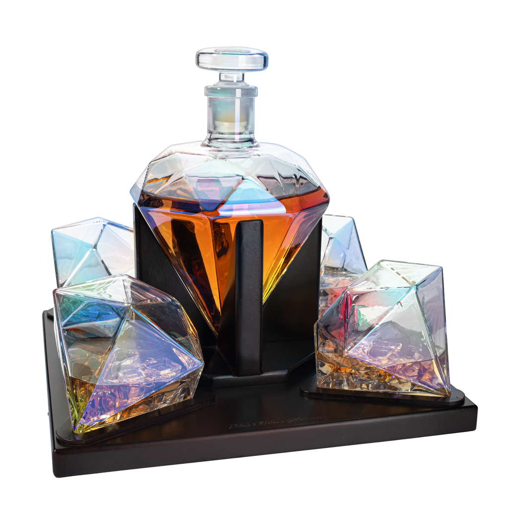 Diamond iridescent whiskey decanter set with two glasses on a mahogany wood stand