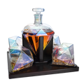 Diamond iridescent whiskey decanter set with two glasses on a mahogany wood stand