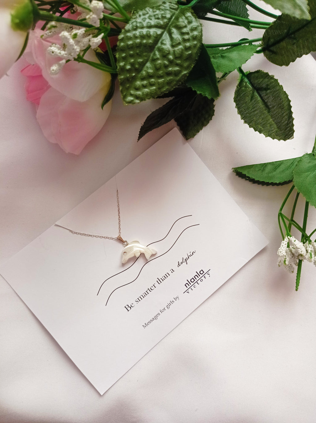 Sterling silver dolphin necklace with mother of pearl charm and an inspiring affirmation message card. — view 3