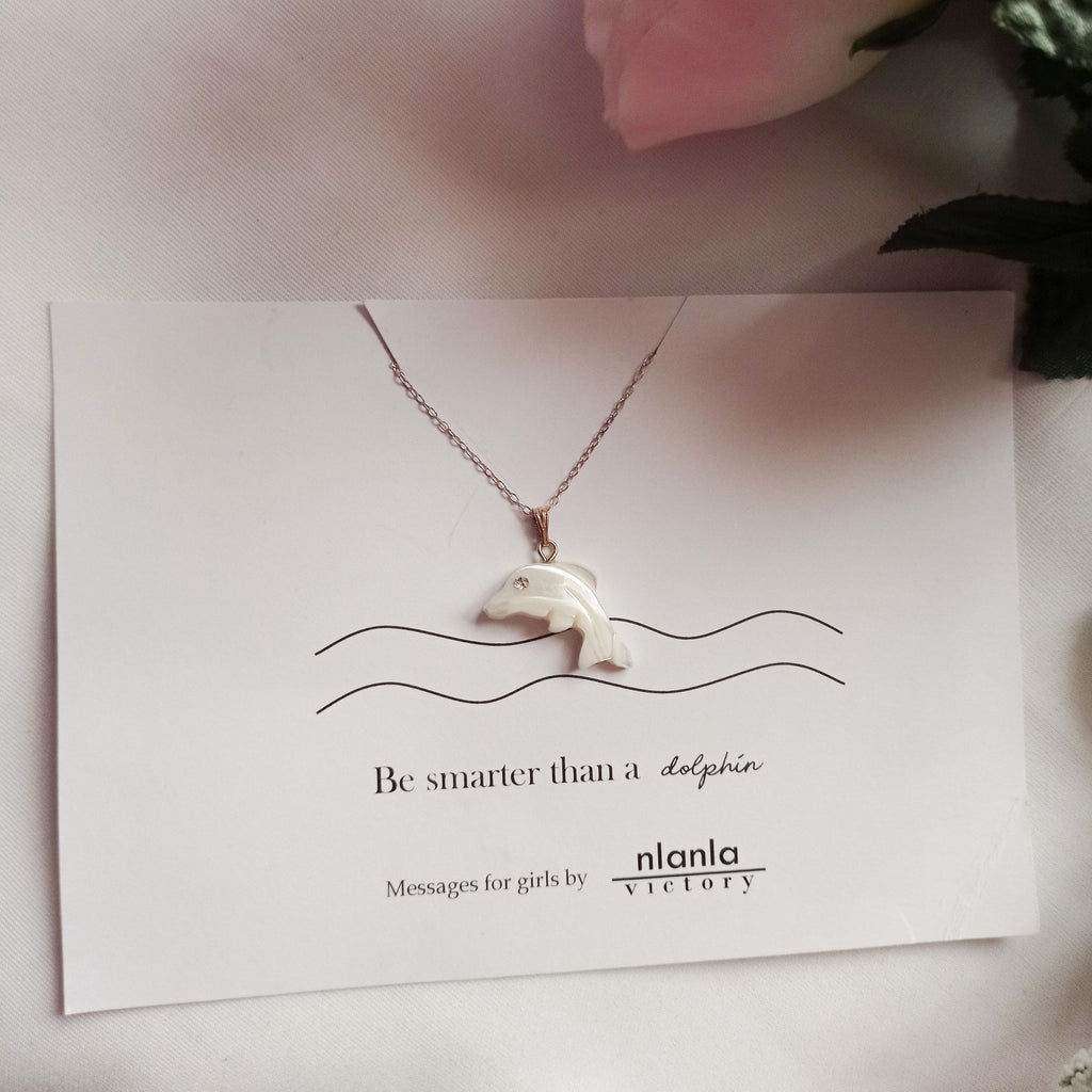 Sterling silver dolphin necklace with mother of pearl charm and an inspiring affirmation message card. — view 4