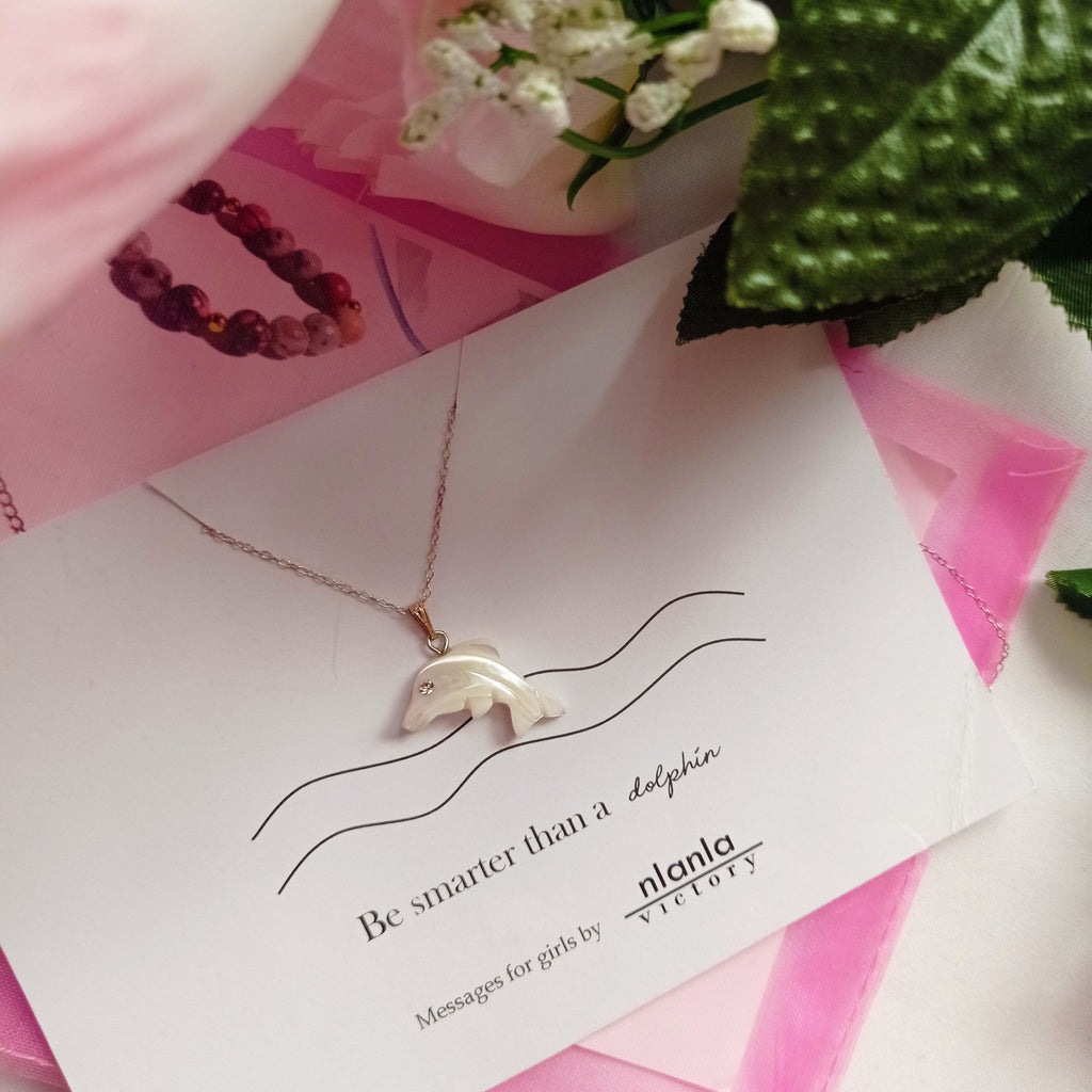 Sterling silver dolphin necklace with mother of pearl charm and an inspiring affirmation message card. — view 5