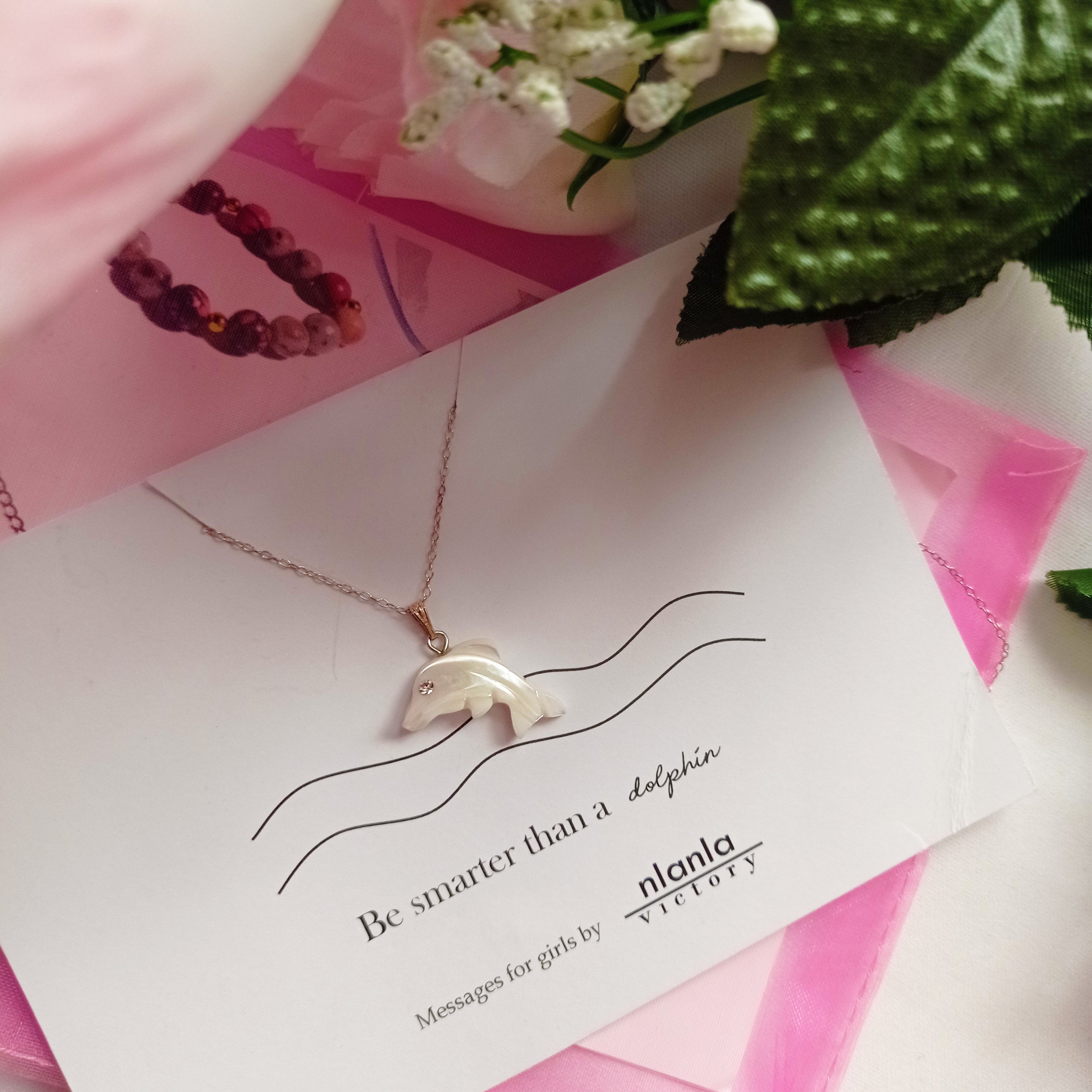 Sterling silver dolphin necklace with mother of pearl charm and an inspiring affirmation message card. — view 5