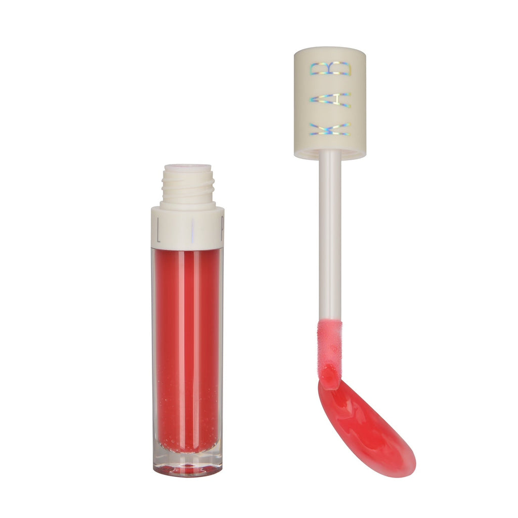 Hydrating tinted lip oil tube with large doe foot applicator and glossy pink sheen — view 4