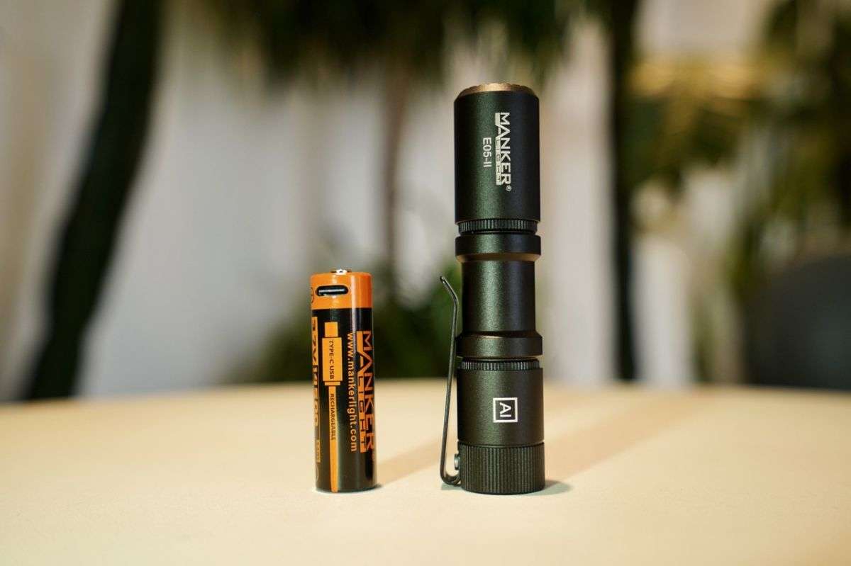 Compact black tactical EDC flashlight with stainless steel deep carry pocket clip. — view 4