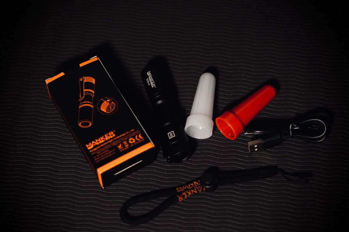 Compact black tactical EDC flashlight with stainless steel deep carry pocket clip. — view 3