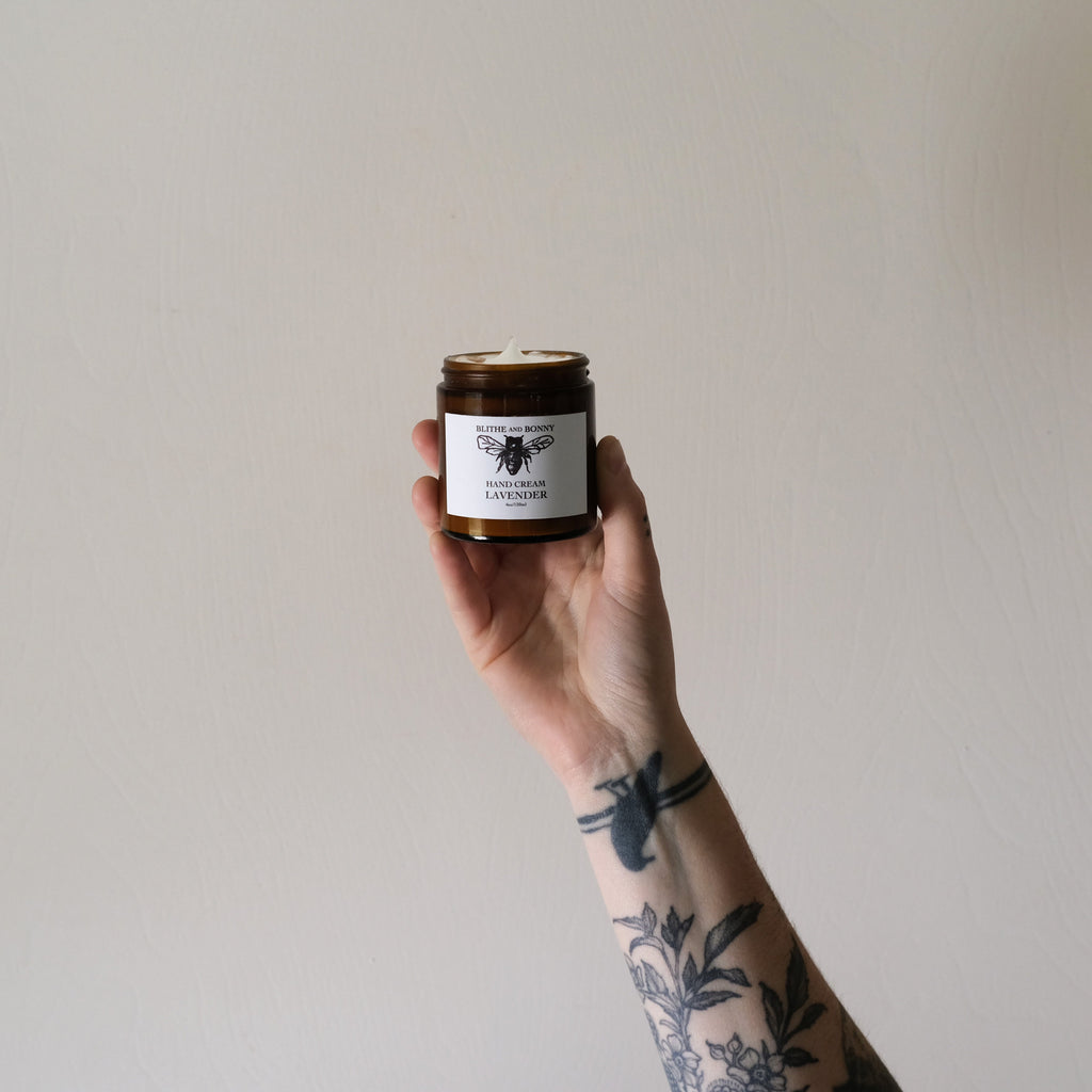 Luxurious vegan hand cream in a four ounce amber glass jar with a metal lid — view 2