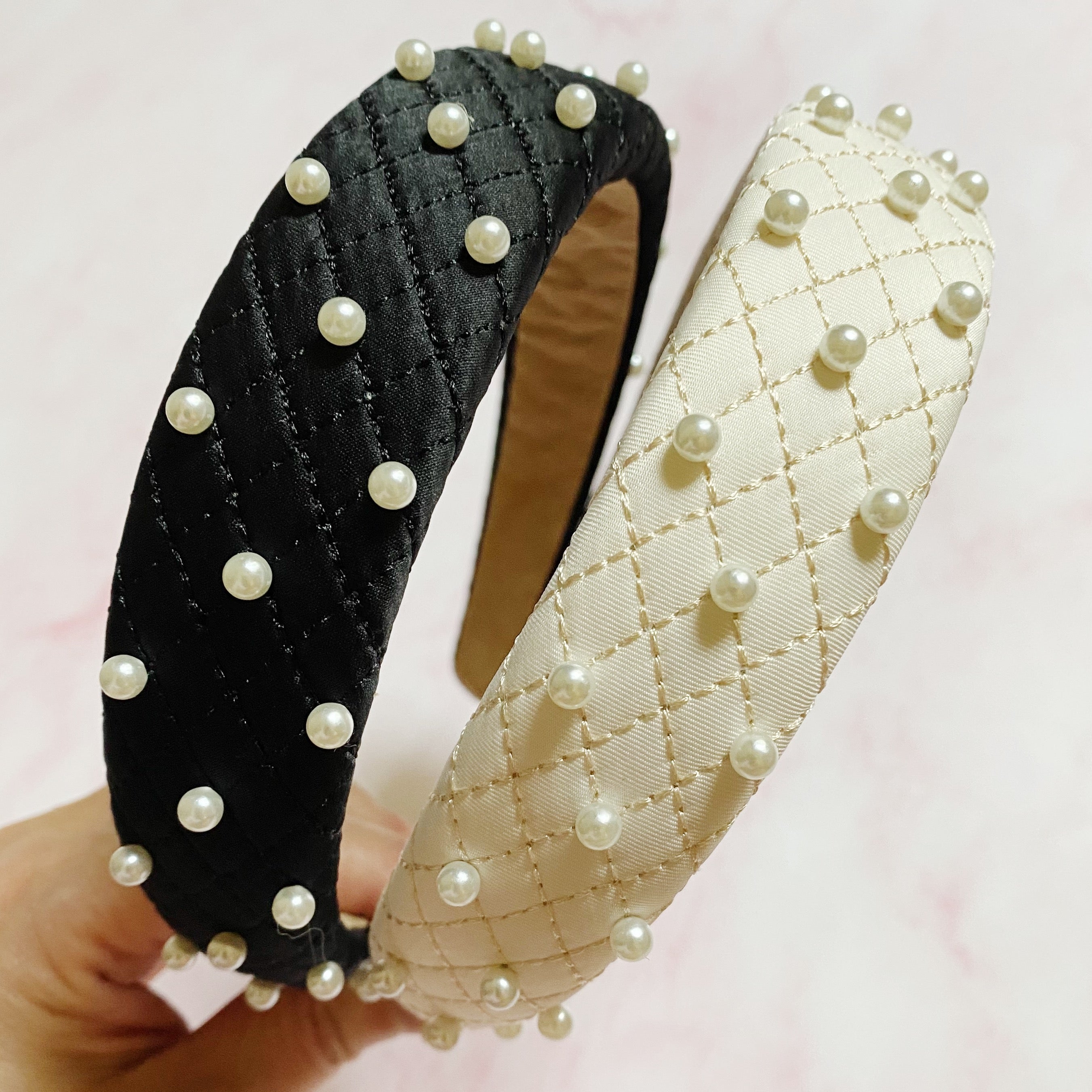 Quilted elegance pearl headband in soft fabric featuring hand-nailed pearls and smooth padded edges