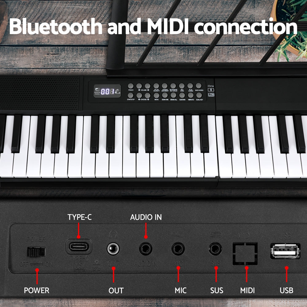 Black 61-key foldable electronic piano keyboard with travel bag, microphone, and sustain pedal — view 4