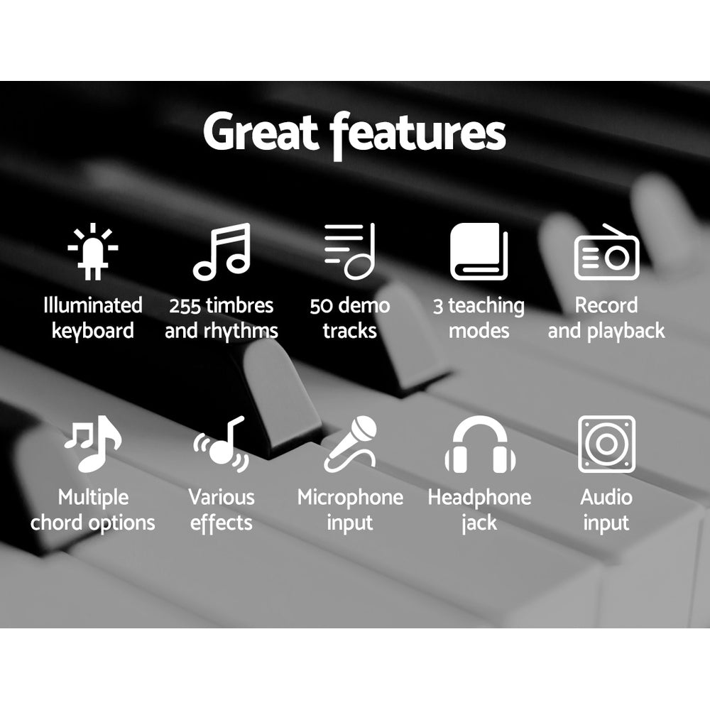 Pink Alpha 61-key electronic piano keyboard on adjustable black stand with music sheet holder — view 5