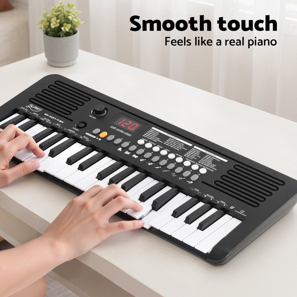 Alpha 37-key digital piano in black, featuring built-in speakers, interface buttons, and compact portable design — view 5