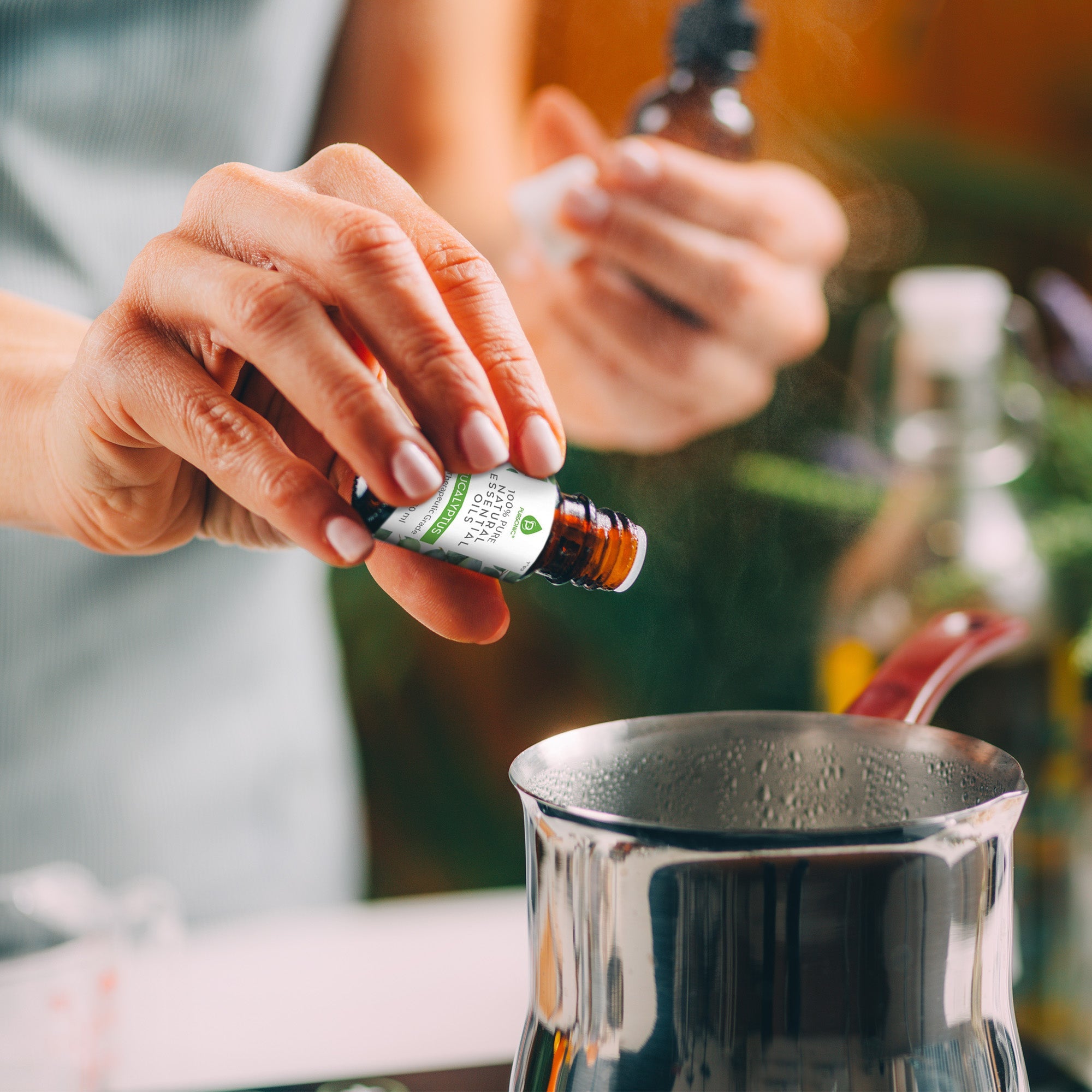 Glass bottle of pure eucalyptus essential oil with a dropper for aromatherapy and soothing massages — view 4