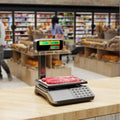 Digital commercial food scale with dual LCD pole display and stainless steel weighing platform