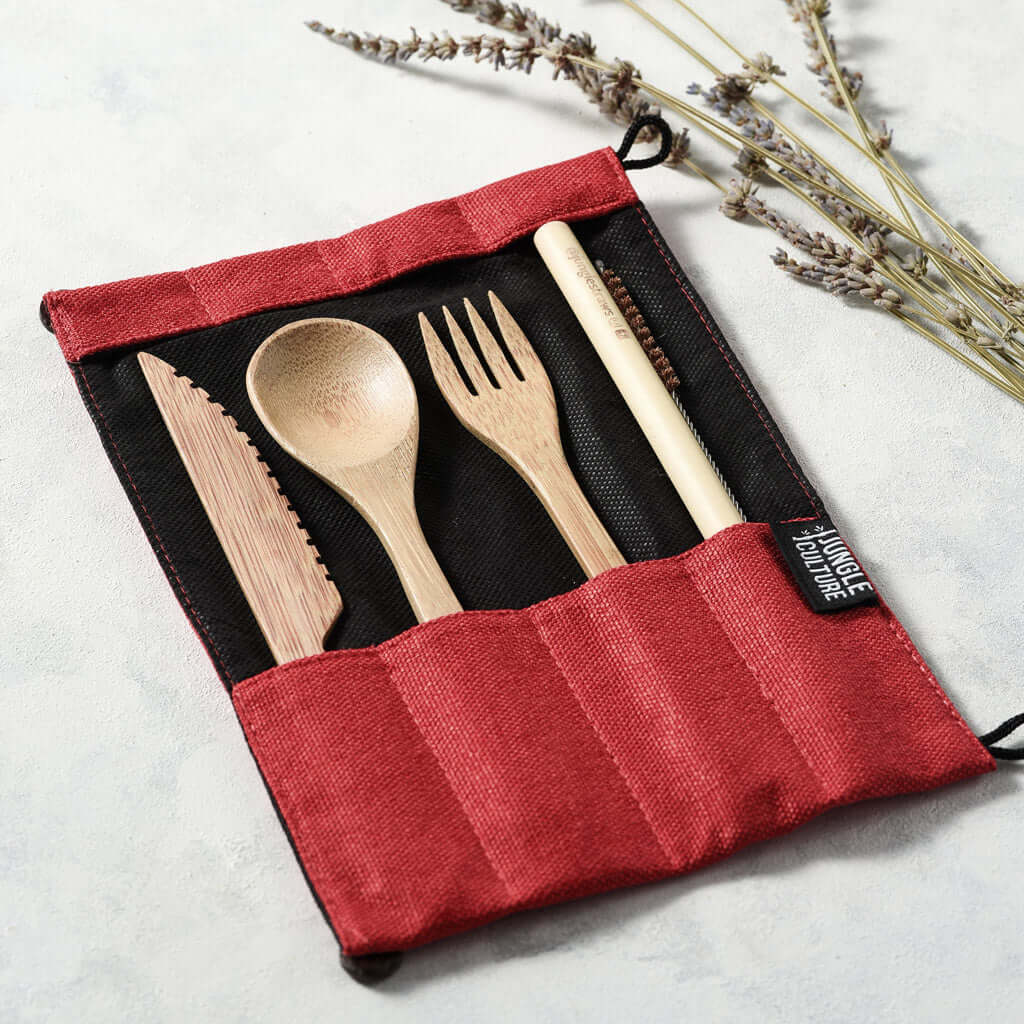 Bamboo travel cutlery set with green pouch, including a wooden fork, knife, spoon, and straw — view 3