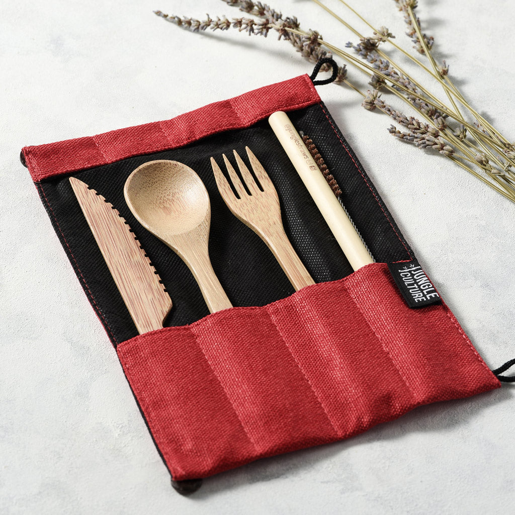Bamboo travel cutlery set with knife fork spoon straw and brush in a red jute bag